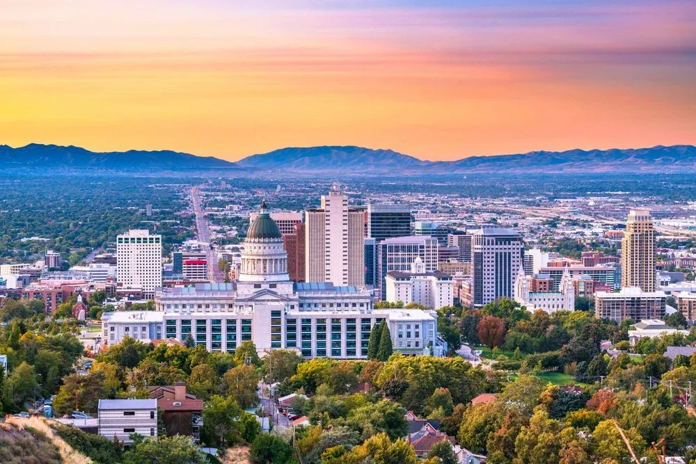 Salt Lake City at sunset, with the Capitol and the Wasatch mountains